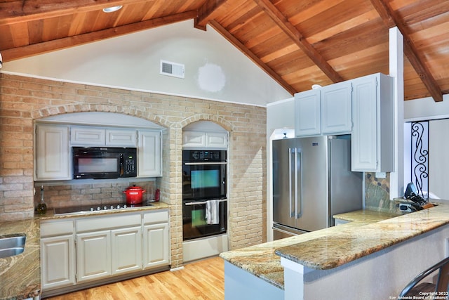 kitchen featuring black appliances, wooden ceiling, light stone countertops, light wood finished floors, and a peninsula
