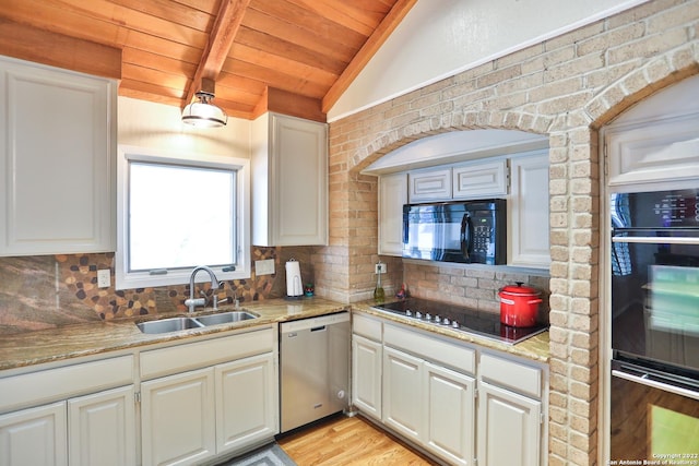 kitchen with black appliances, a sink, wood ceiling, tasteful backsplash, and white cabinetry