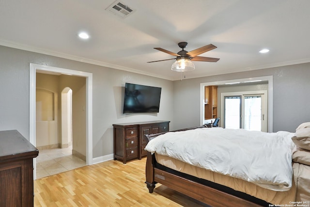 bedroom featuring ornamental molding, access to outside, arched walkways, light wood-style floors, and recessed lighting