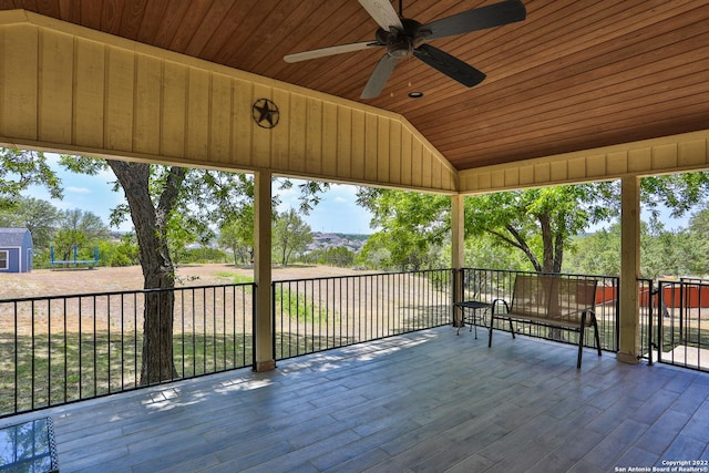 wooden deck featuring a ceiling fan