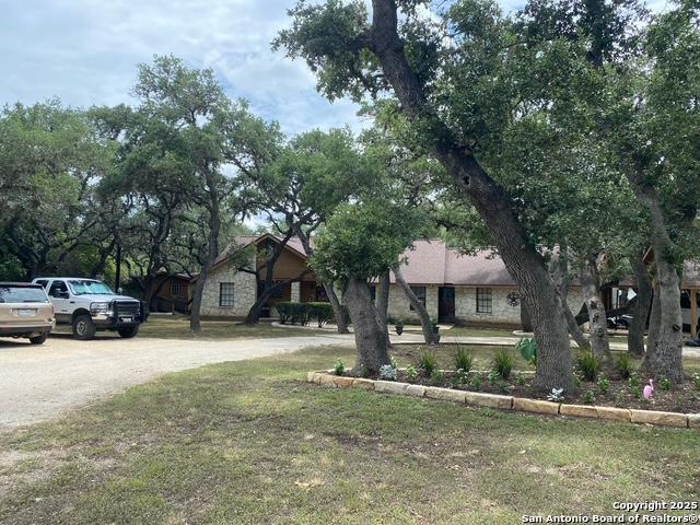 9516 Geronimo Oaks, San Antonio, TX 78254 - view of front of house featuring stone siding