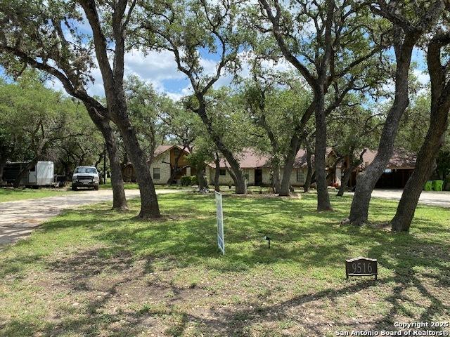 9516 Geronimo Oaks, San Antonio, TX 78254 - view of grassy yard