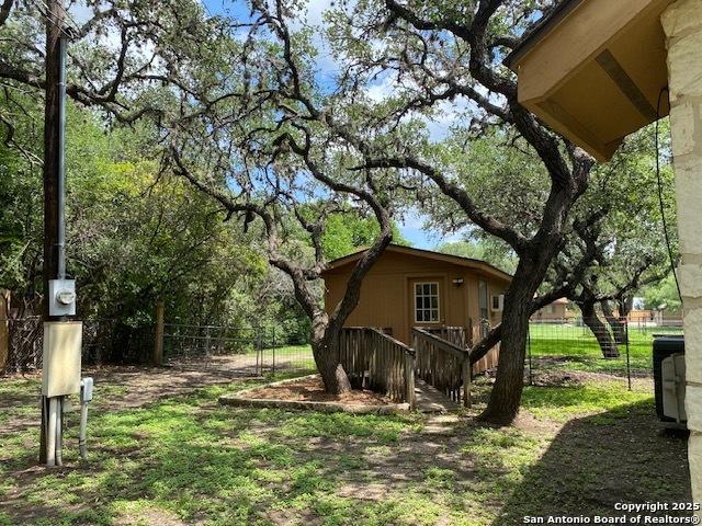 9516 Geronimo Oaks, San Antonio, TX 78254 - view of side of home featuring fence