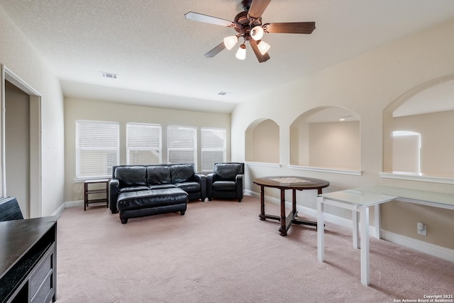 18211 Branson Fls, San Antonio, TX 78255 - living area featuring light carpet, ceiling fan, and baseboards