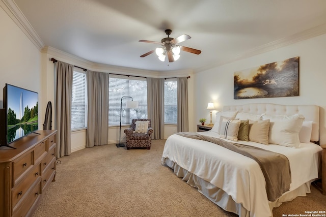 bedroom with crown molding, light colored carpet, a ceiling fan, and baseboards