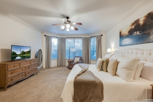 bedroom with ornamental molding, light colored carpet, and ceiling fan