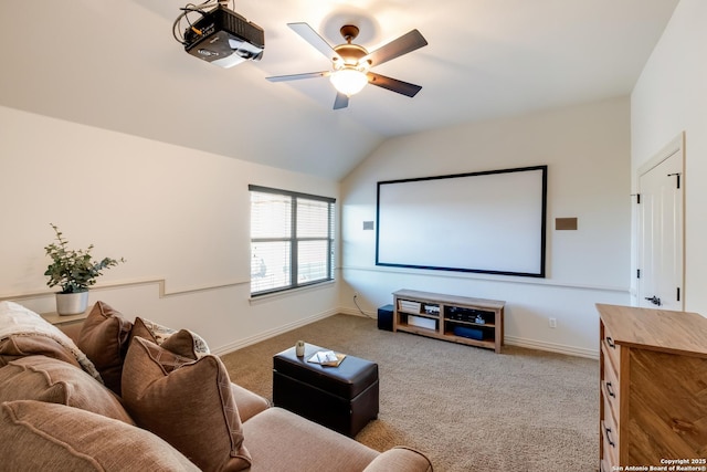 home theater featuring ceiling fan, carpet, vaulted ceiling, and baseboards
