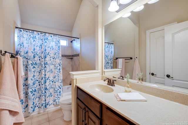 bathroom featuring vanity, tile patterned flooring, toilet, lofted ceiling, and shower / tub combo