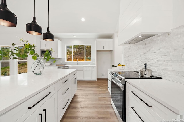 410 Compass Rose, Canyon Lake, TX 78133 - kitchen featuring stainless steel appliances, backsplash, light wood-type flooring, white cabinetry, and recessed lighting