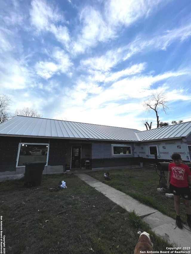 314 Veda Mae, San Antonio, TX 78216 - view of front of property with a standing seam roof, a front yard, and metal roof