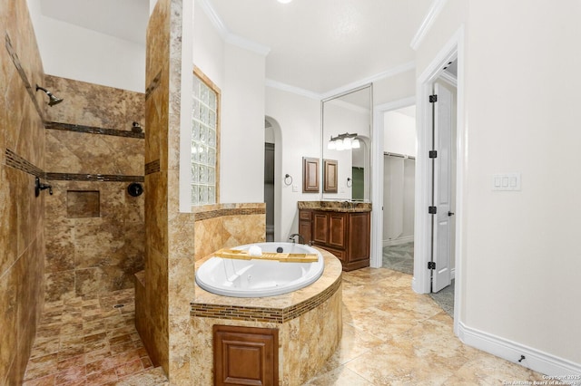 bathroom featuring walk in shower, a tub with jets, ornamental molding, vanity, and a walk in closet