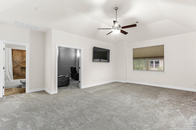 unfurnished bedroom featuring carpet flooring, baseboards, ensuite bathroom, and a ceiling fan
