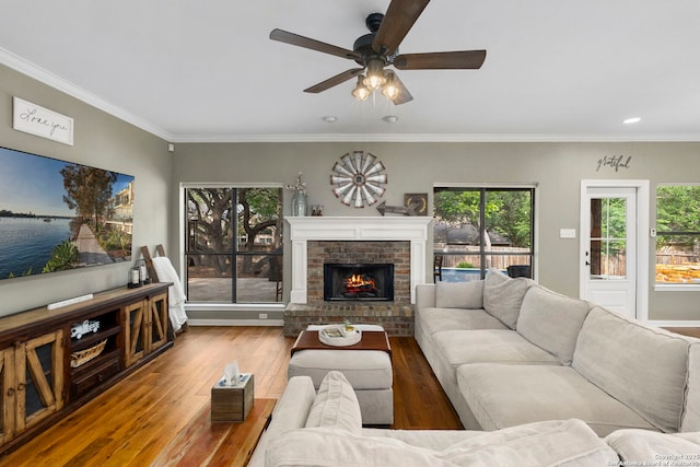 16222 Deer Crst, San Antonio, TX 78248 - living area featuring wood finished floors, ceiling fan, a brick fireplace, recessed lighting, and crown molding