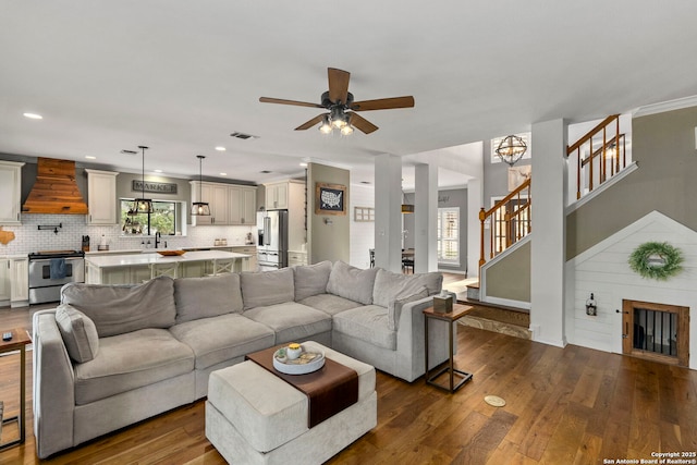 16222 Deer Crst, San Antonio, TX 78248 - living area with dark wood-type flooring, ceiling fan, stairway, recessed lighting, and baseboards