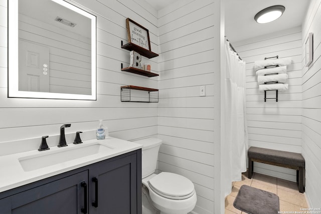 16222 Deer Crst, San Antonio, TX 78248 - full bathroom with wooden walls, toilet, vanity, tile patterned flooring, and curtained shower