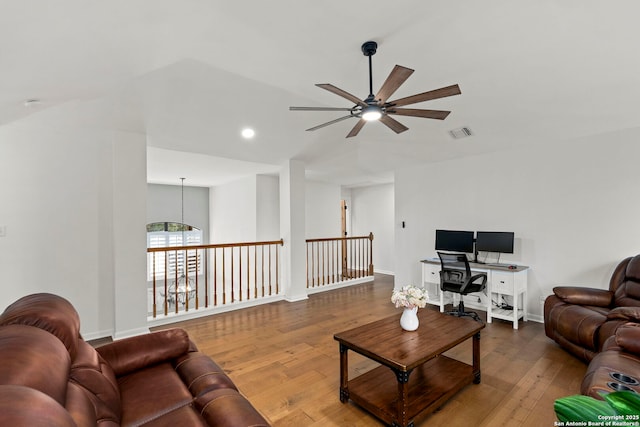 16222 Deer Crst, San Antonio, TX 78248 - living area featuring a ceiling fan, wood finished floors, vaulted ceiling, a desk, and baseboards