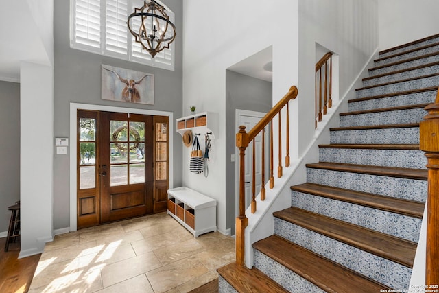 16222 Deer Crst, San Antonio, TX 78248 - entryway featuring a towering ceiling, baseboards, stairs, and a chandelier