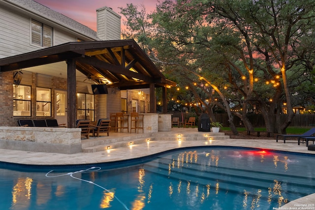 16222 Deer Crst, San Antonio, TX 78248 - pool at dusk featuring a ceiling fan and a patio area