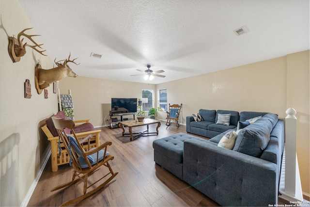 13303 Sunset Rainbow, San Antonio, TX 78245 - living area featuring baseboards, a ceiling fan, and wood finished floors