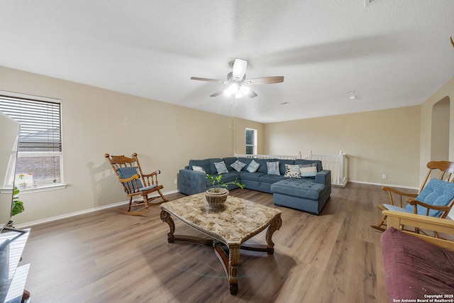 13303 Sunset Rainbow, San Antonio, TX 78245 - living area with wood finished floors, baseboards, and a ceiling fan