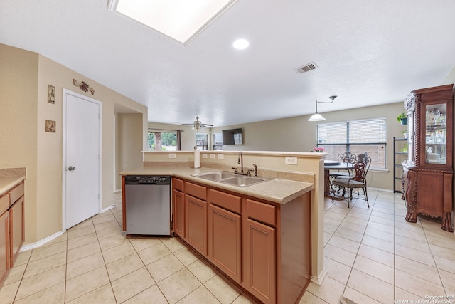 13303 Sunset Rainbow, San Antonio, TX 78245 - kitchen with dishwasher, a sink, light tile patterned floors, and light countertops