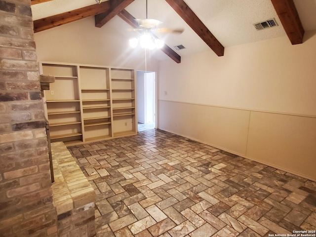 unfurnished room featuring ceiling fan and brick floors