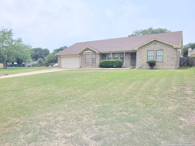 single story home with an attached garage, brick siding, and driveway