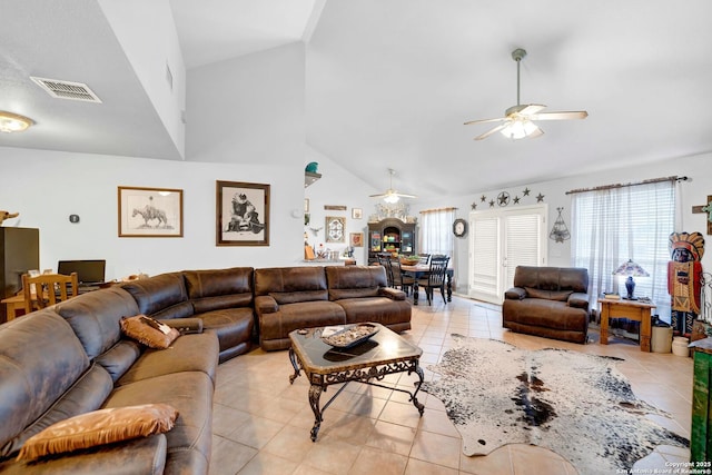 living area with a ceiling fan, high vaulted ceiling, and light tile patterned flooring