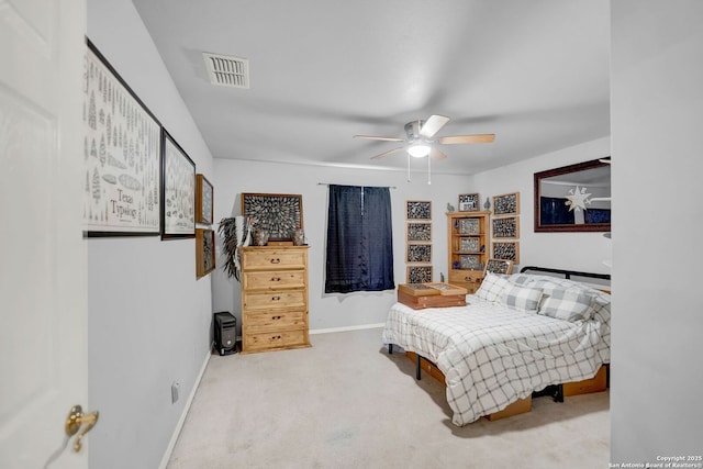 carpeted bedroom featuring baseboards and ceiling fan
