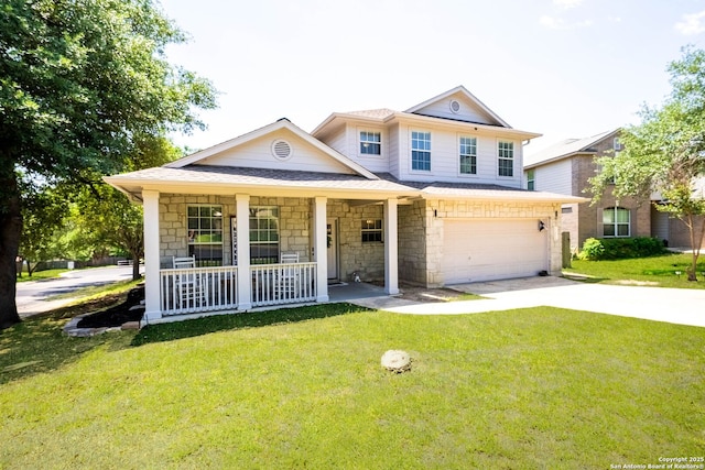 view of front facade featuring a porch, a garage, driveway, and a front yard
