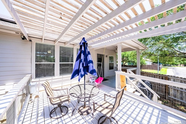 wooden deck with fence, a pergola, outdoor dining area, and ceiling fan