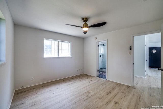 2114 S Trinity St, San Antonio, TX 78207 - unfurnished bedroom featuring wood finished floors, ensuite bathroom, baseboards, and ceiling fan
