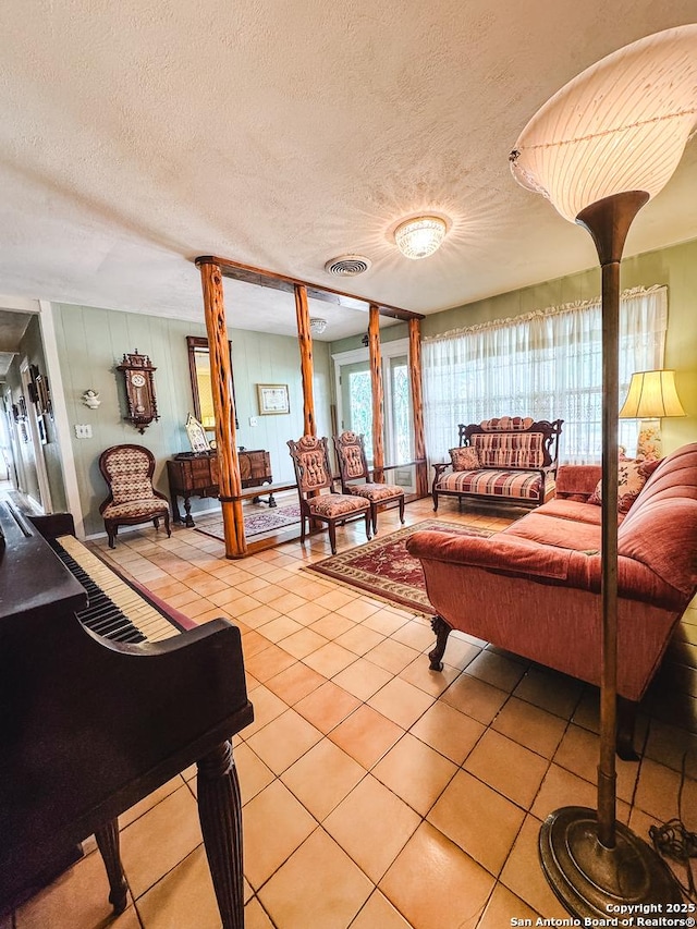 6719 State Highway 55, Uvalde, TX 78801 - living room featuring light tile patterned floors and a textured ceiling