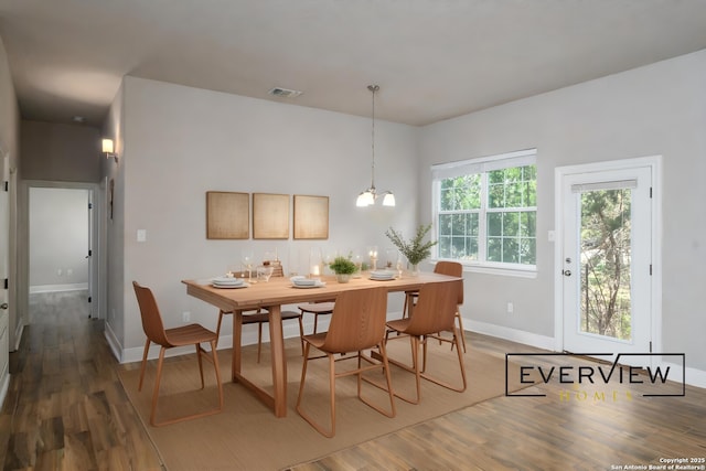 3039 View Rdg Unit 3, Spring Branch, TX 78070 - dining area with baseboards, wood finished floors, and a chandelier