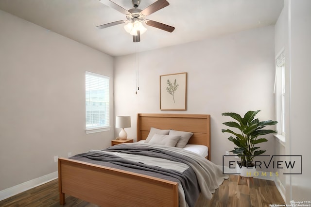 3039 View Rdg Unit 3, Spring Branch, TX 78070 - bedroom with wood finished floors, baseboards, and a ceiling fan