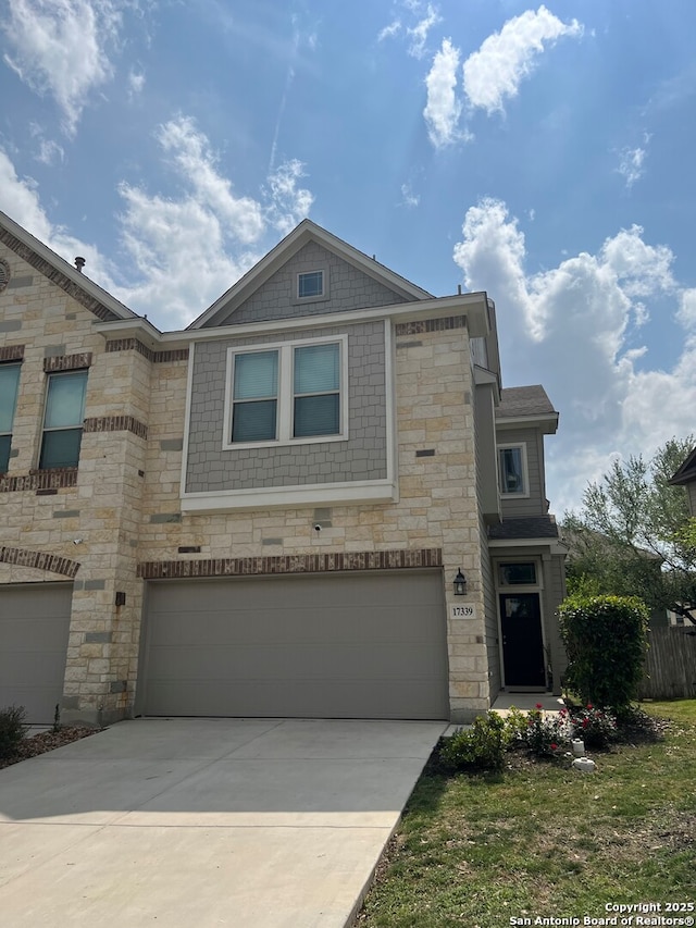 17339 Brachetto, San Antonio, TX 78247 - view of front of property with an attached garage, driveway, and stone siding