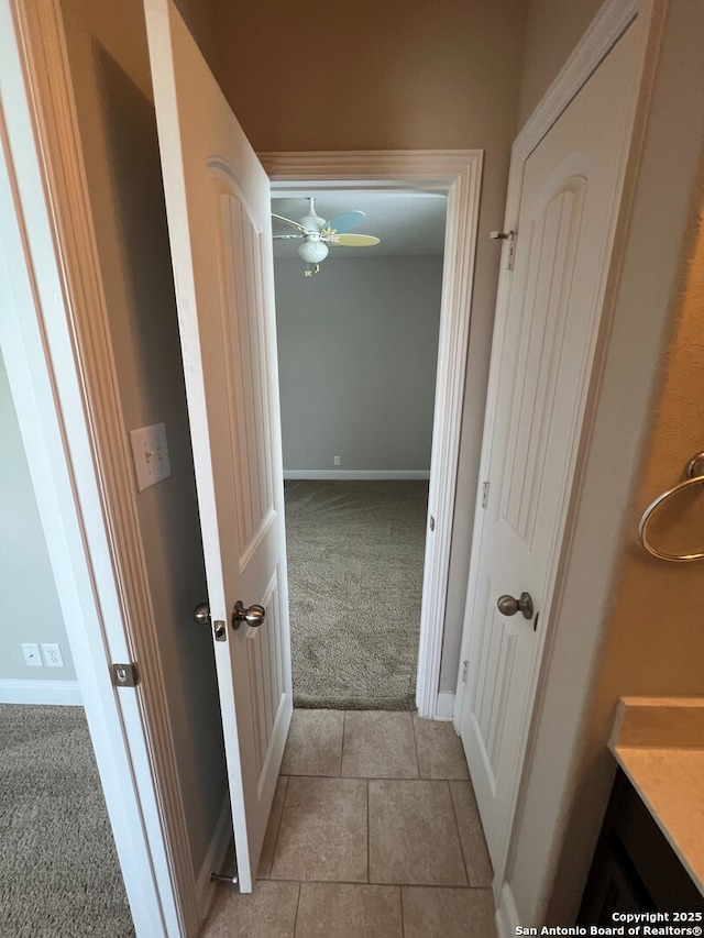17339 Brachetto, San Antonio, TX 78247 - hall with carpet floors, baseboards, and tile patterned floors