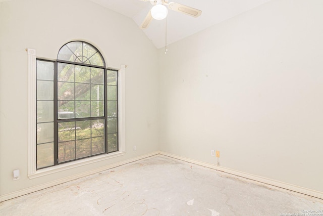 unfurnished room featuring plenty of natural light, lofted ceiling, a ceiling fan, and baseboards