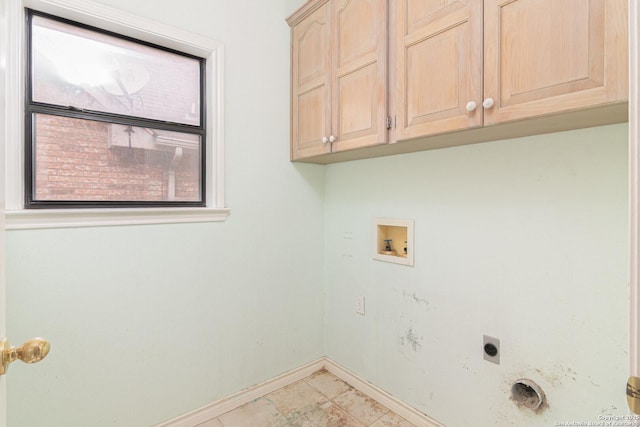 laundry area with cabinet space, electric dryer hookup, hookup for a washing machine, and baseboards