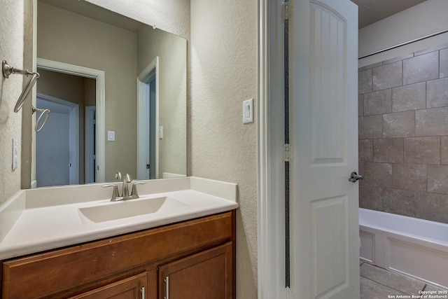 12418 Maverick Rnch, San Antonio, TX 78254 - full bath with a textured wall, vanity, shower / bathtub combination, and tile patterned flooring