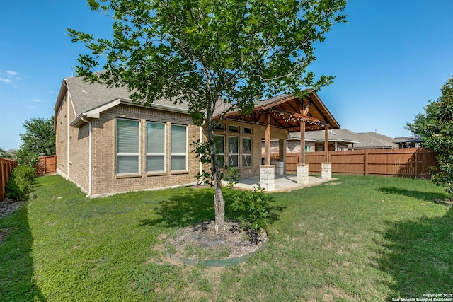 12418 Maverick Rnch, San Antonio, TX 78254 - back of house featuring a patio and brick siding