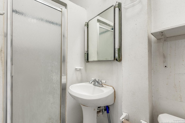 806 Kayton Ave, San Antonio, TX 78210 - bathroom with toilet, a sink, and a shower