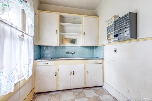 806 Kayton Ave, San Antonio, TX 78210 - kitchen featuring a sink, healthy amount of natural light, light countertops, and backsplash