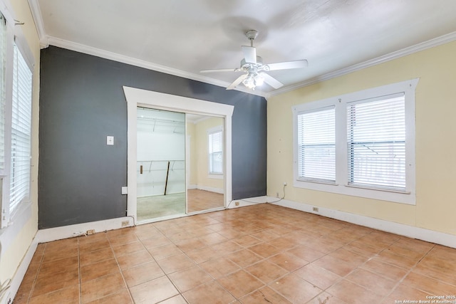 806 Kayton Ave, San Antonio, TX 78210 - unfurnished bedroom with crown molding, a closet, light tile patterned floors, ceiling fan, and baseboards