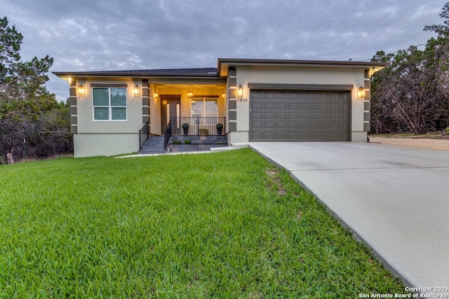 7812 Ventura Blvd, Selma, TX 78154 - view of front of property featuring stucco siding, a front lawn, driveway, an attached garage, and covered porch