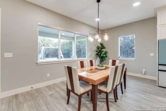 7812 Ventura Blvd, Selma, TX 78154 - dining space with baseboards, light wood-style flooring, recessed lighting, and a chandelier