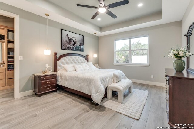 7812 Ventura Blvd, Selma, TX 78154 - bedroom with a raised ceiling, baseboards, light wood-style floors, recessed lighting, and a ceiling fan