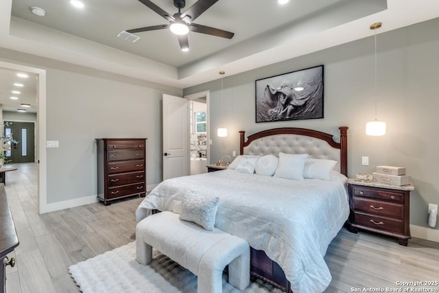 7812 Ventura Blvd, Selma, TX 78154 - bedroom featuring a tray ceiling, baseboards, light wood-type flooring, recessed lighting, and ceiling fan