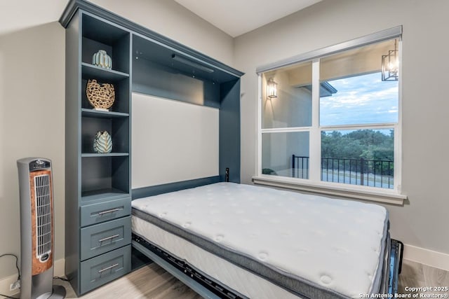 7812 Ventura Blvd, Selma, TX 78154 - bedroom featuring baseboards and wood finished floors