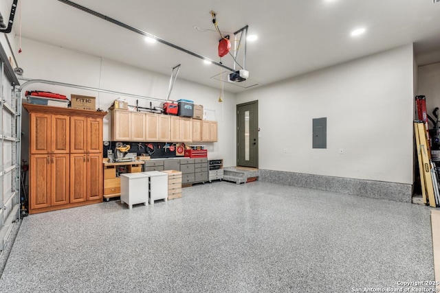 7812 Ventura Blvd, Selma, TX 78154 - garage with electric panel, a garage door opener, and recessed lighting